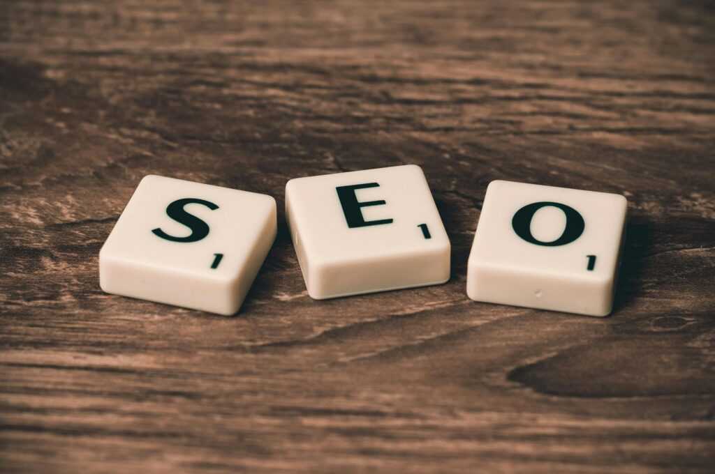 pexels-photo-270637-270637 Scrabble tiles spelling 'SEO' on a wooden surface. Ideal for digital marketing themes.AEO vs SEO